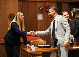 Photo of two people in suits shaking hands. Links to Closely Held Business Stock